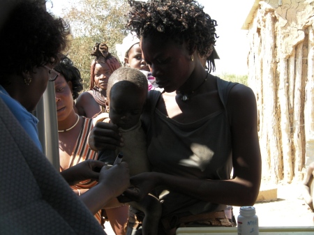Marking the right thumb of a child immunised as part of Kunene Namibia National Immunisation Days 2011 Round One